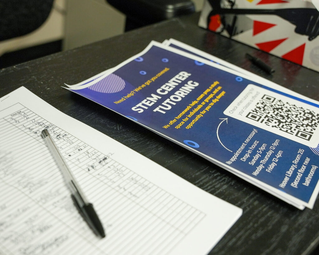 Flyers and a sign-up sheet for STEM tutoring.