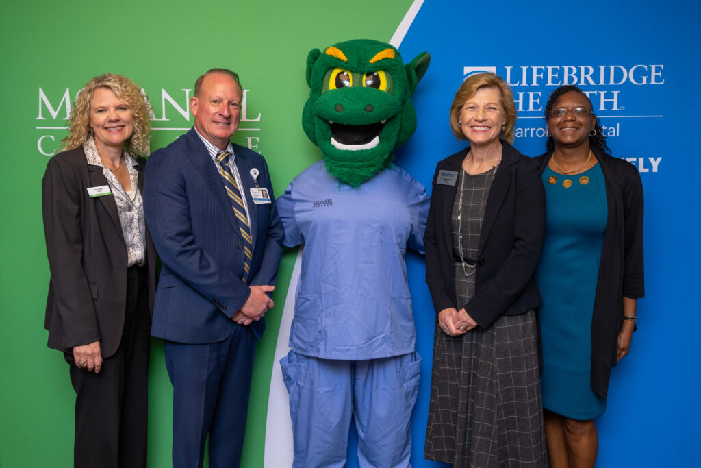 President Julia Jasken and leaders of LifeBridge Health with the Green Terror.