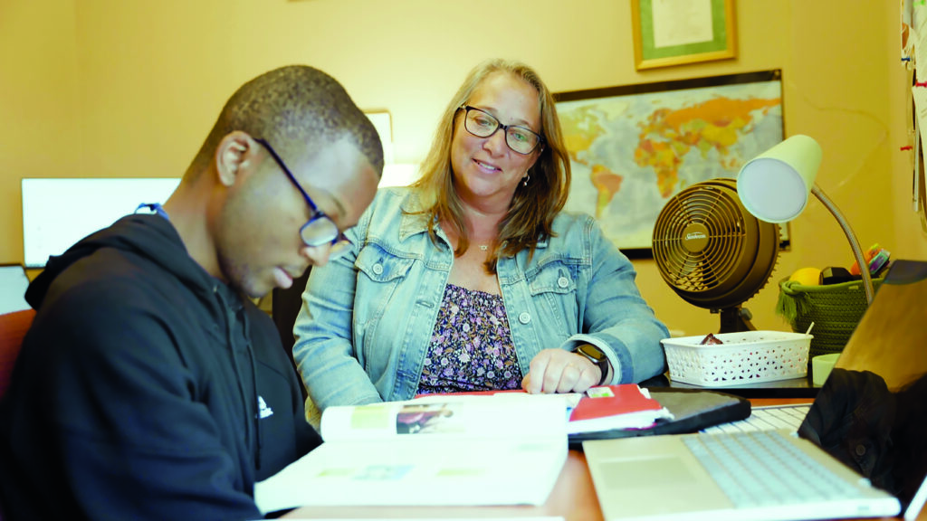 A student working independently with a SASS counselor.