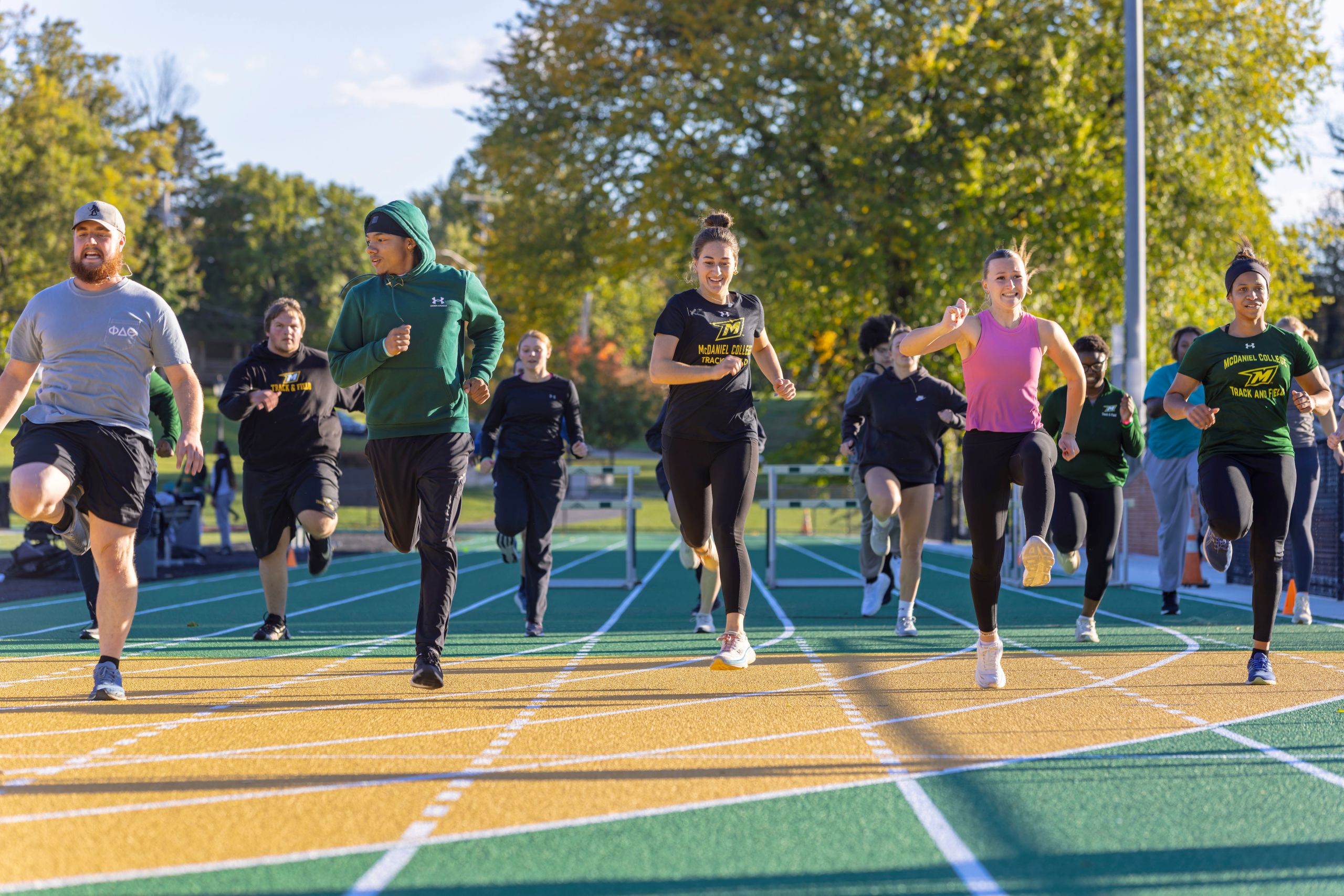 Students perform a ceremonial lap around the renovated track.