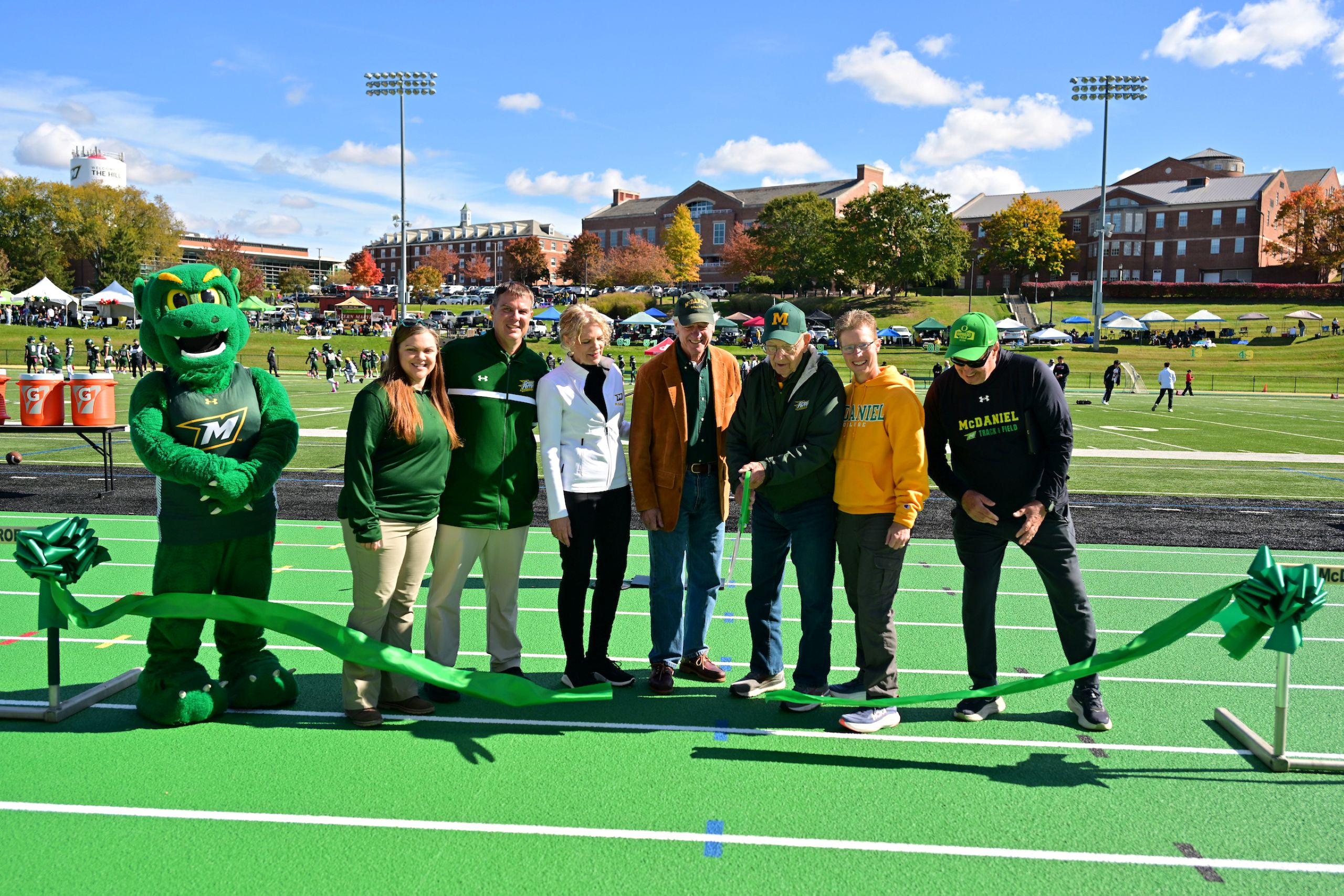 Ribbon cutting ceremony to dedicate the renovated track.
